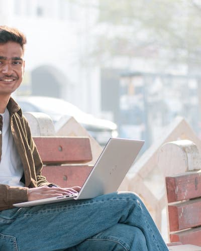 Indian boy learning with laptop